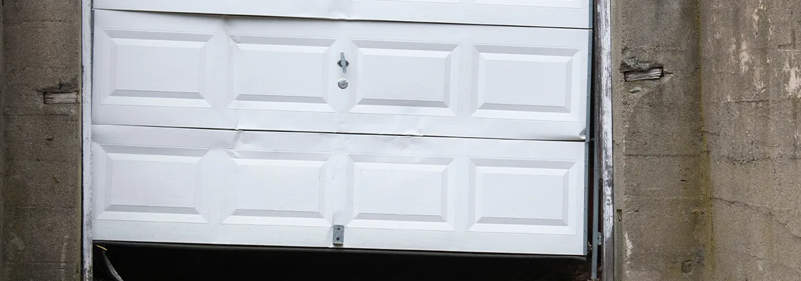 Garage Door Got Hit By A Car Dent Removal in Fredricton, NB