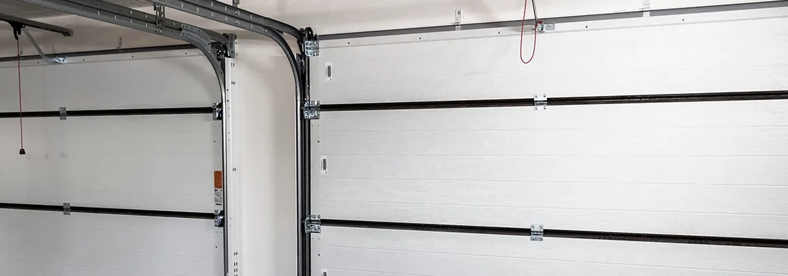 Fix Folding Garage Door Jerking in Fredricton, New Brunswick